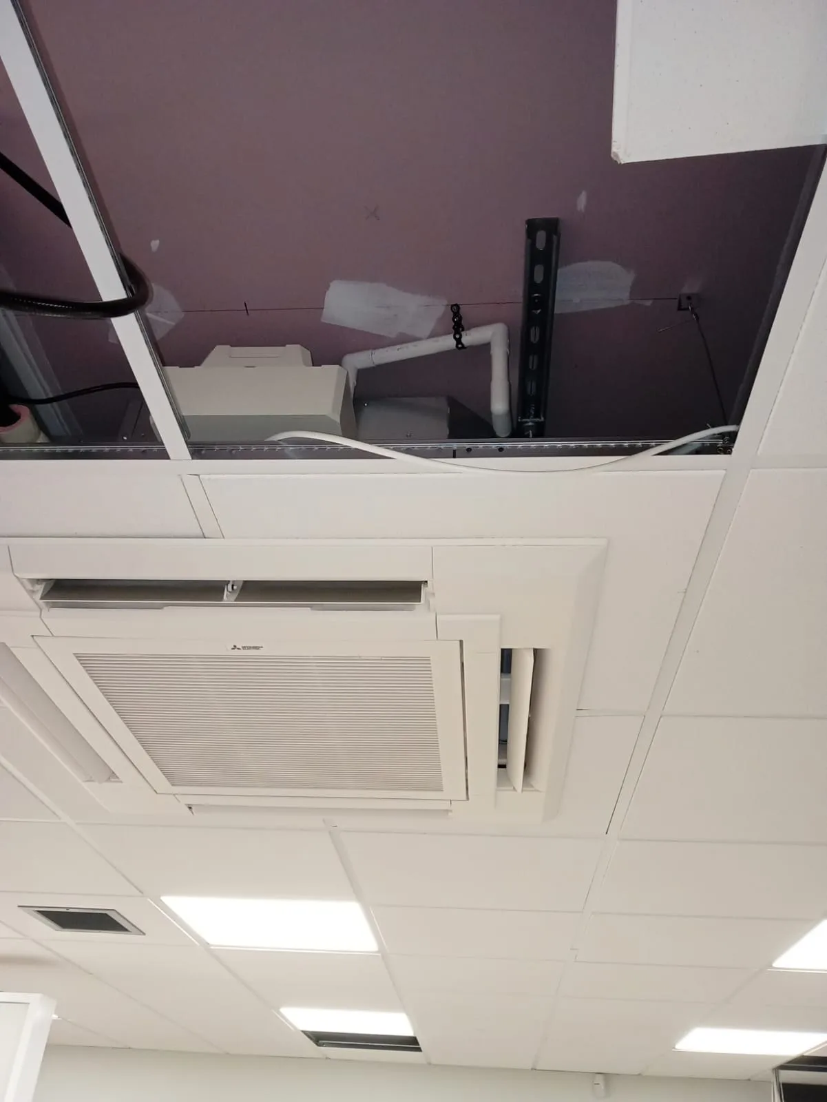 Mitsubishi Electric ceiling cassette installed in a commercial suspended ceiling